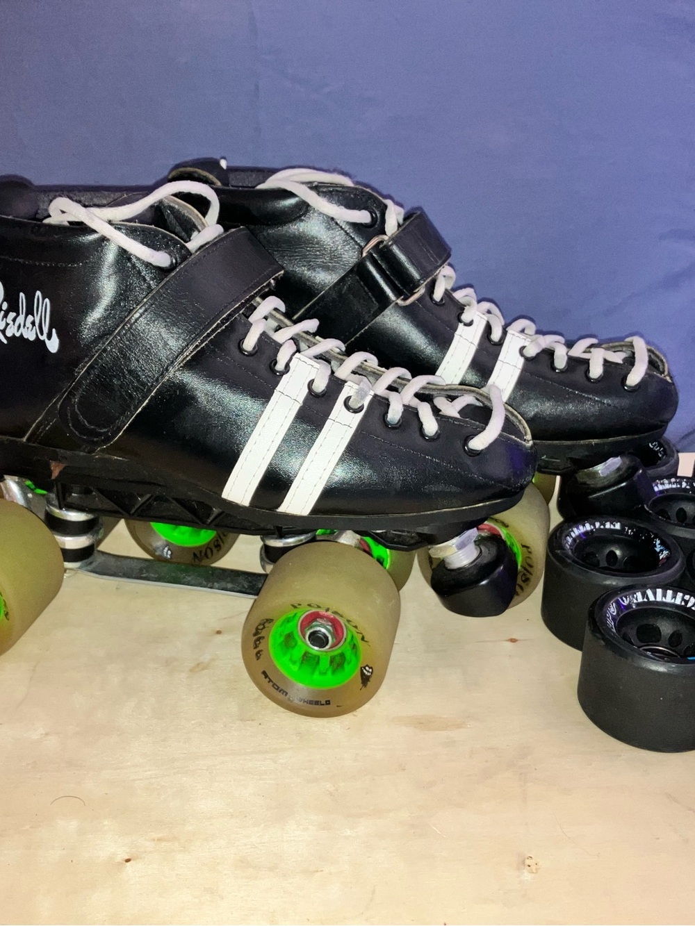 Riedel Black Roller Skates with White Stripes and Green-Core Wheels